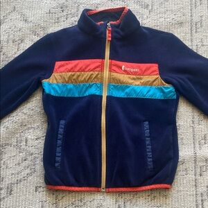 Cotopaxi Kids Puffer Jacket in Navy, Red, and Gold